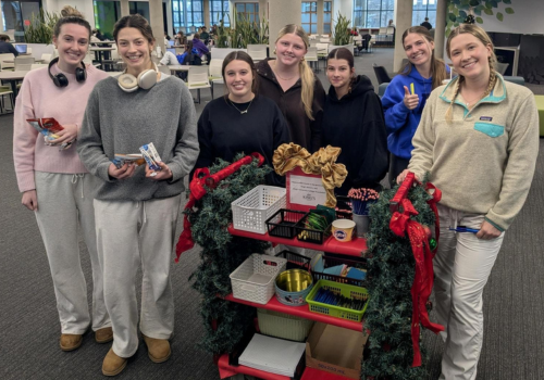 Students with Library Exam Trolley